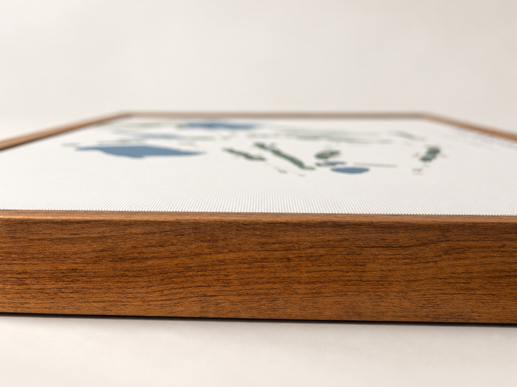 Close-up of the natural wood frame and woven canvas surface of Saddleback Golf Course wall art